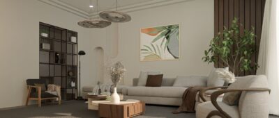 Açık renkli köşe kanepe, tek tablo ve bitkilerle döşenmiş sade, minimalist bir salon